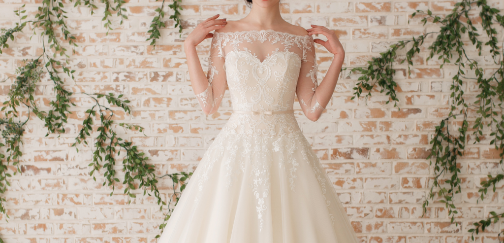 A lace topped ball gown style wedding dress