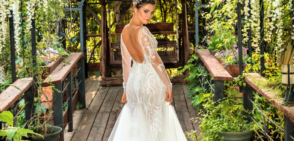 Bride atnding on a plant covered