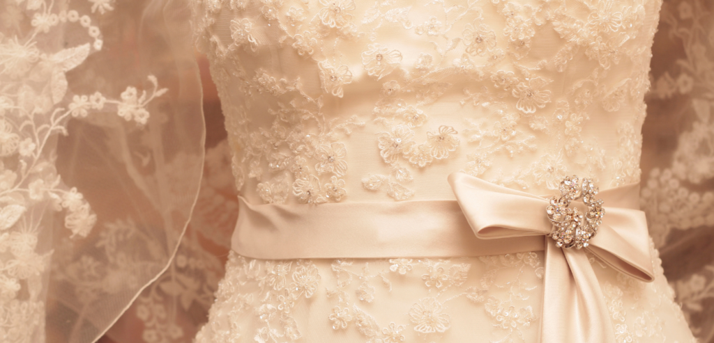 A sheath wedding dress with a well defined waistline