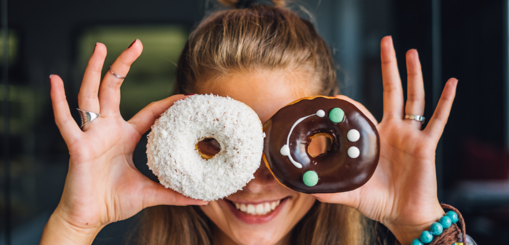 Two donuts, a powdered sugar one and a chocolate one