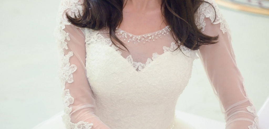 A long sleeve wedding gown with lace on the bodice and sleeves