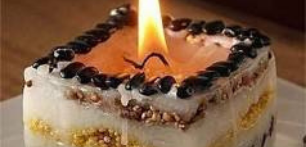 Square candle embellished with seeds