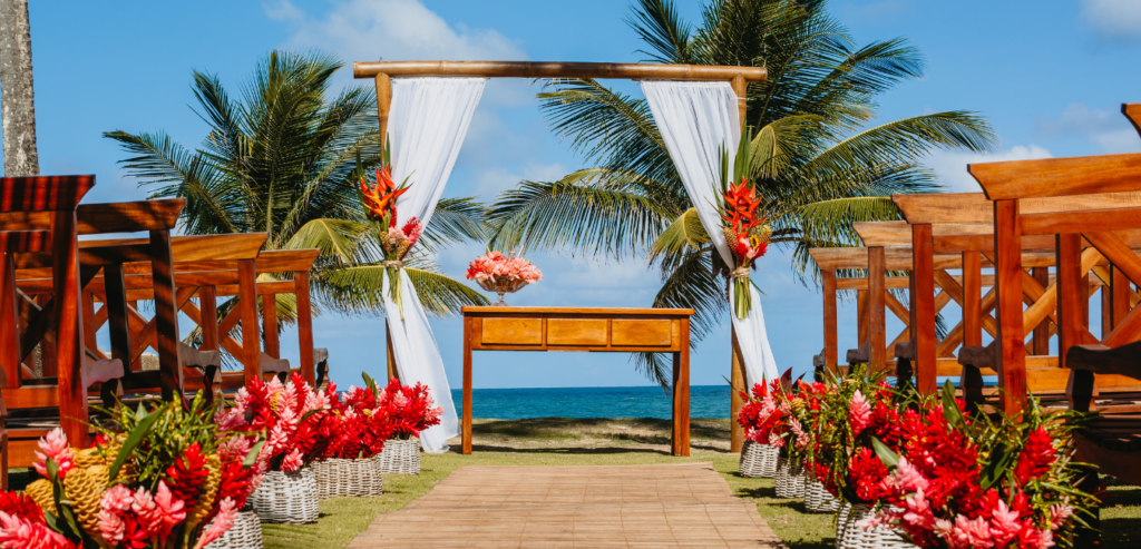 A beautiful beach wedding accented with colorful tropical flowers