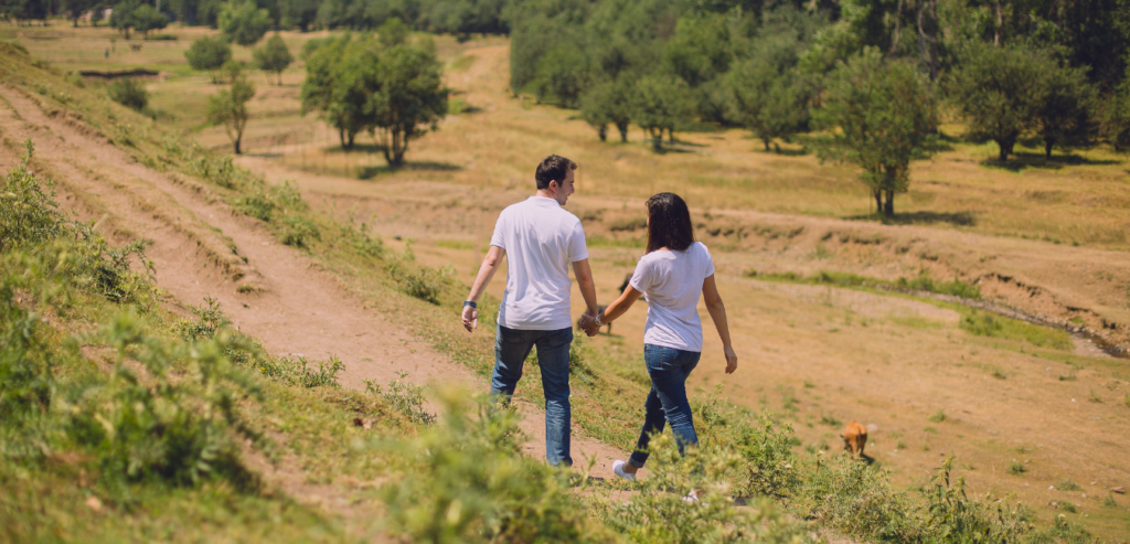 Couple walks on country road